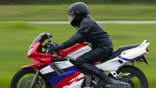 A person riding a motorbike.