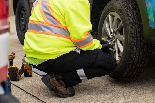 Image showing tire technician changing a tire.