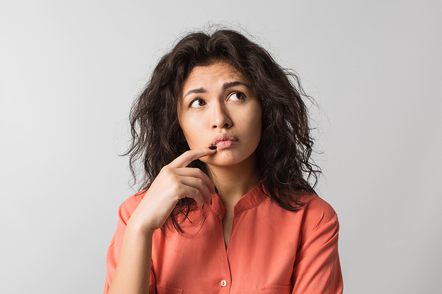 A young woman with a concerned look on her face.