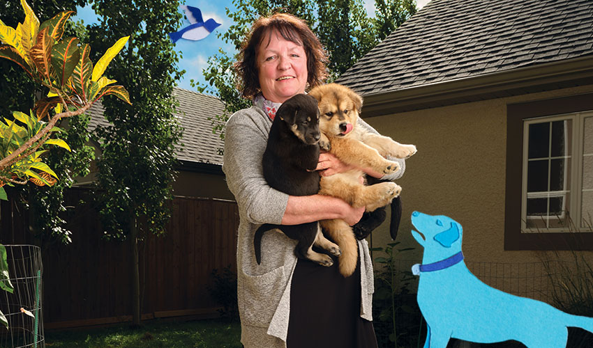 Woman holding two dogs