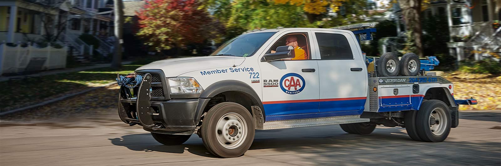 Image featuring CAA tow truck during autumn.