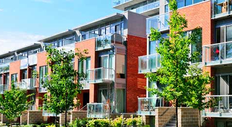 The outside view of a modern three-story condo.