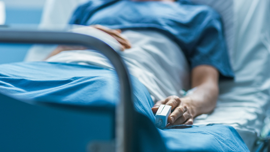 Person in hospital bed.