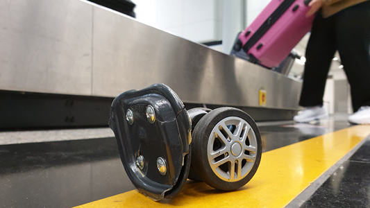 Broken wheel off of rolling luggage.