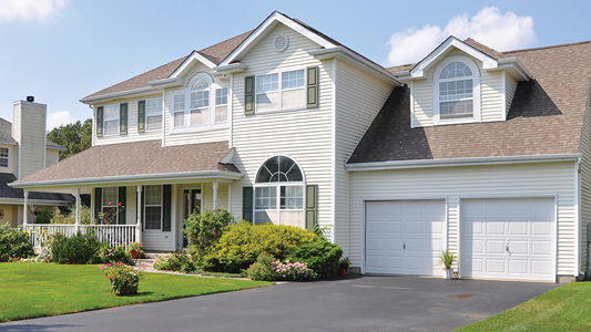 New 2 story home with 2 car garage and landscaped front yard.