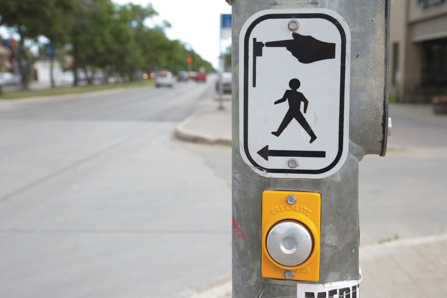 Image showing crossing button and instructions sign on crosswalk pole on typical sreet.