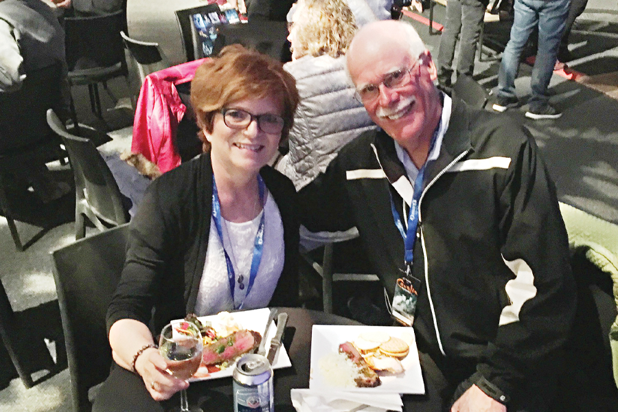 Photo of two CAA contest winners enjoying dinner.