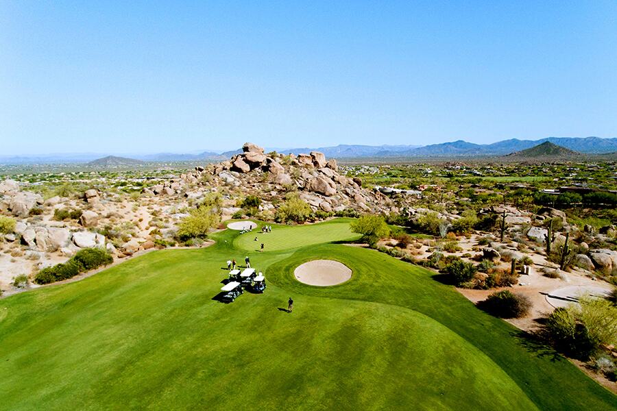 Image showing aerial view of golf green with golf carts.