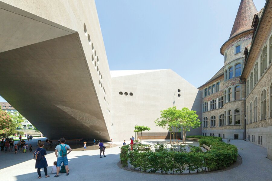 Photo showing juxtaposition of modern and medieval architecture in Zurich.