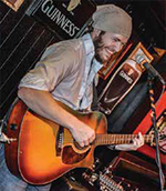 Young musician playing the guitar.