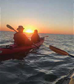 Paddling in a kayak.