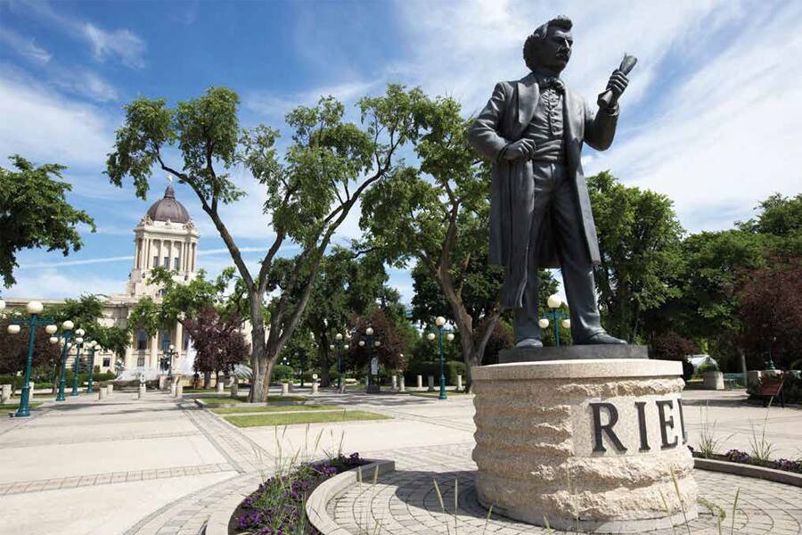 A statue of Louis Riel in front of the Manitoba Legislative Building.
