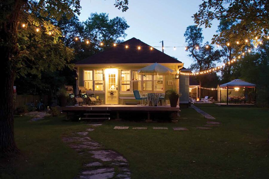 Image showing exterior of cabin lit up at night.