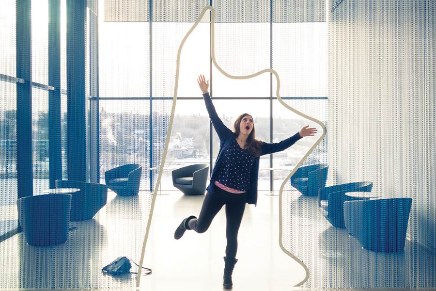 Image showing yound woman posing with a piece of artwork inside an art gallery.