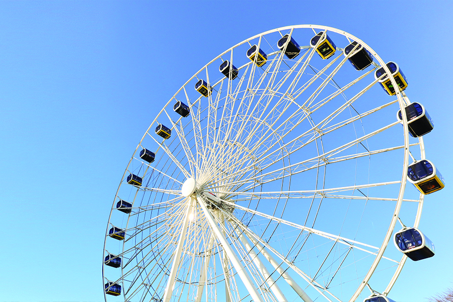 Image showing large ferris wheel structure carrying gondola viewing cars.