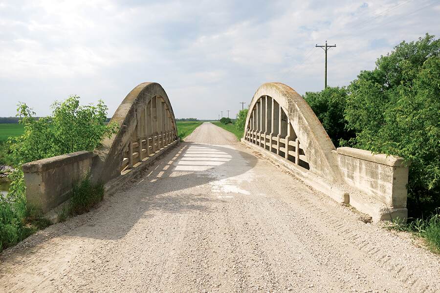 Image showing a stone bridge over a small river in rural Manitoba.