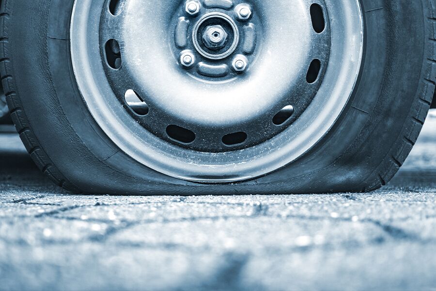 Image showing a side view of a flat tire.
