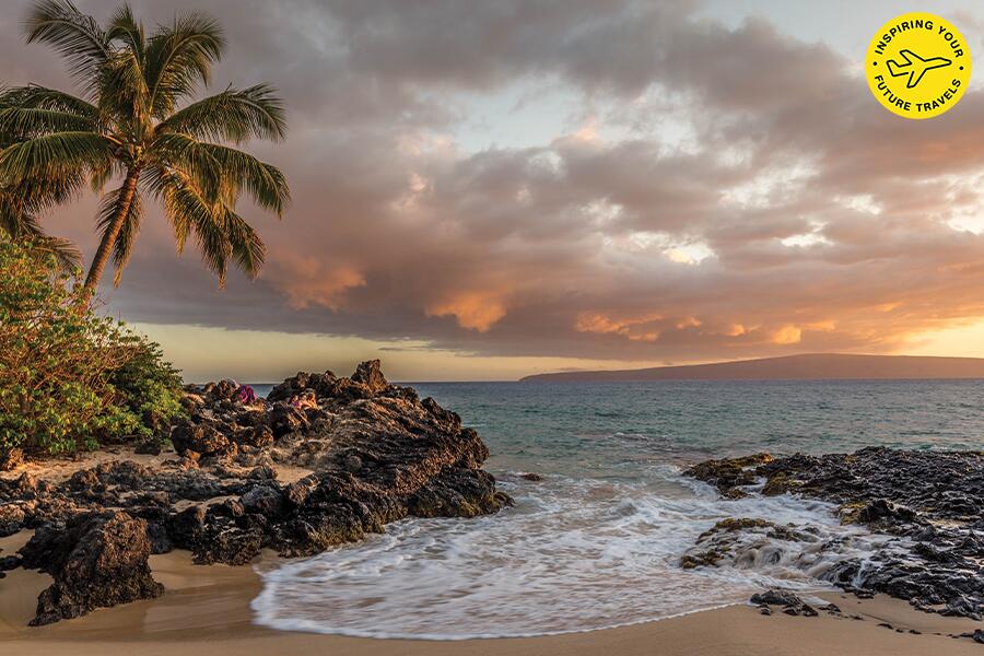 Image showing rocks, surf, palm trees and a setting sun on the KiHei coastline.