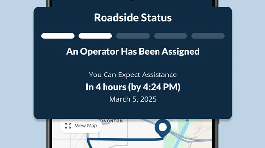 Phone featuring close up of CAA Mobile App Roadside Status screen.