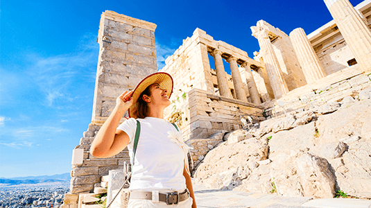 A female tourist admiring the Parthenon in summer