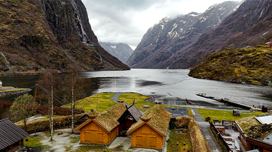 An ancient Viking village next to a Norwegian fjord.