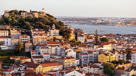 Lisbon cityscape with St. George Castle at sunset