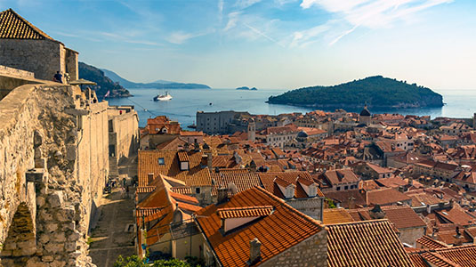 Dubrovnik old town rooftops and Adriatic coast.