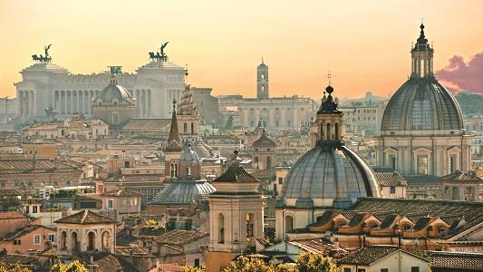 View of rooftops of Rome in evening light.