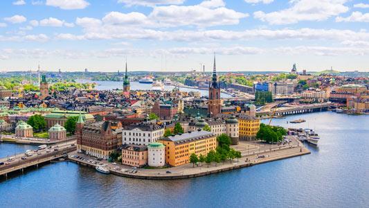 European buildings surrounded by a river.