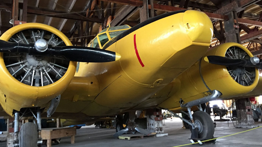 Image showing a World War 2 era Avro Anson trainer aircraft inside a hanger.