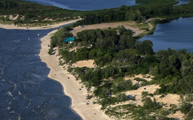 Image showing an aerial view of Grand beach with lakes nearby.
