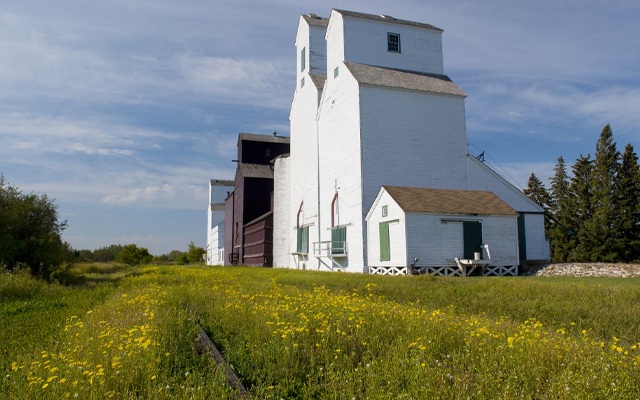 Image showing a line of old-style wooden grain elevators.