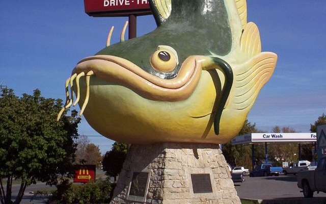 Image showing a large stylized statue of a smiling catfish.
