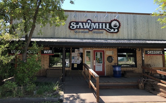 Image showing the exterior of a brown building with the words Sawmill Tea and Coffee Company.