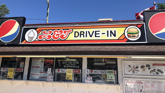 Image showing the exterior of a restaurant with a sign reading L and J Drive In.