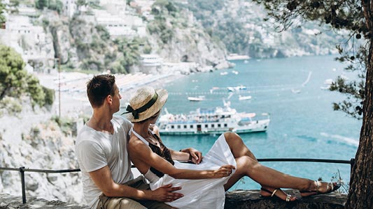A couple looking out at the ocean.