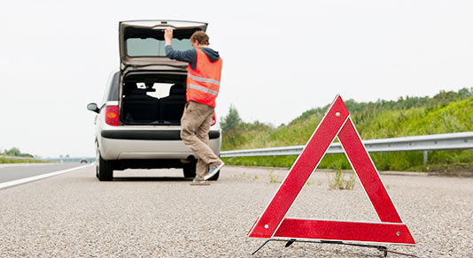 Car broken down on side of highway