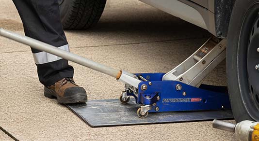 Mechanic changing car tire