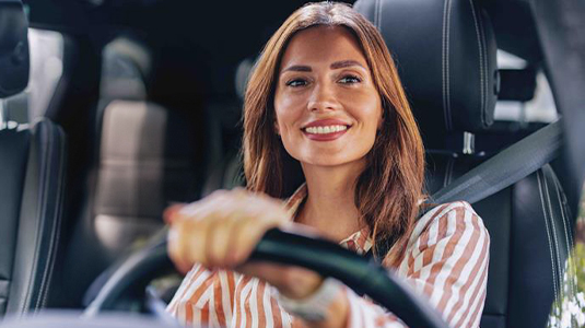 A woman driving in a car