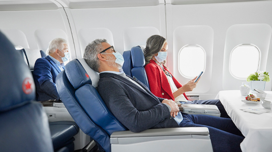Couple resting on a plane.