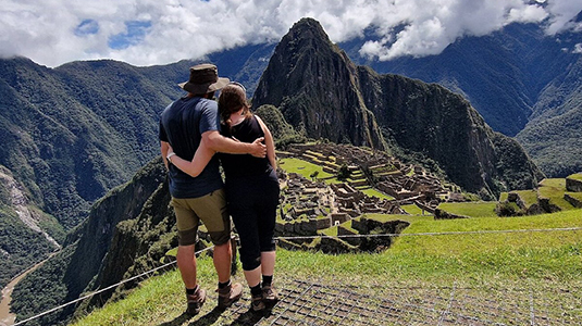 Two people looking over machu picchu