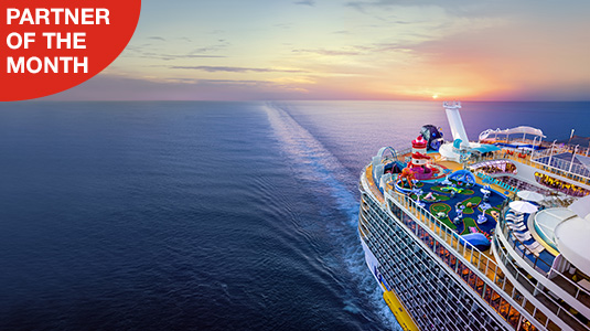 Royal Caribbean cruise ship arial side view with sunset. Partner of the month.